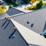 Installers providing high-quality roofing solutions on a residential home with a team effort.