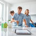 Cleaning service team thoroughly cleaning a modern kitchen, showcasing their expertise.