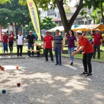 Komunitas aktif bermain petanque di fopikotamakassar.org dengan suasana meriah dan dukungan dari penonton.